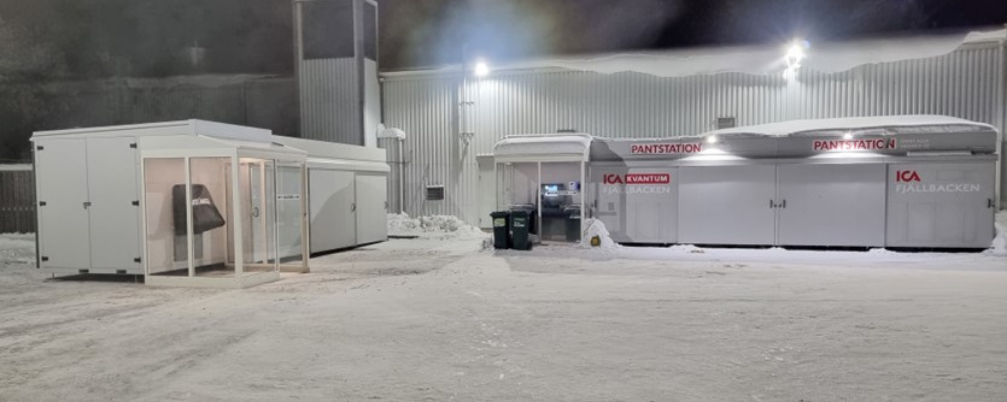 Envipco Quantum Bulk Reverse Vending Machine standing outside in the cold covered in snow